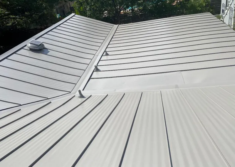 Solar attic fan installed on a metal roof for Roof Ventilation in Benton Park